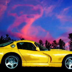 Viper yellow sports car with logo in the clouds