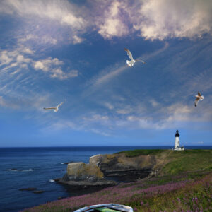 Yaquina Lighthouse with birds and a boat