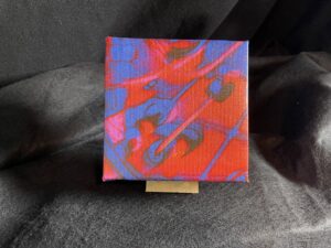 Reds Have The Blues is an Abstract Modern Art Gallery Wrapped Mini 6 x 6 canvas with a handmade easel by artist Michael John Valentine of Huntersville