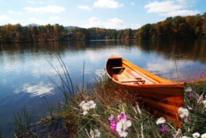 Wooden Boat on a Lake Wall Art by Artist Michael John Valentine of Huntersville