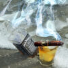 Jack Daniel's and Late Hour Davidoff Cigar In The Surf by artist Michael John Valentine