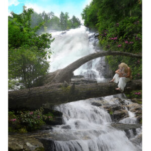 Lady holding a fawn painting by a mountain waterfall in North Carolina