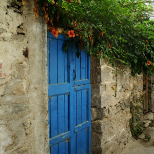 The Blue Door With Orange Flowers Greece